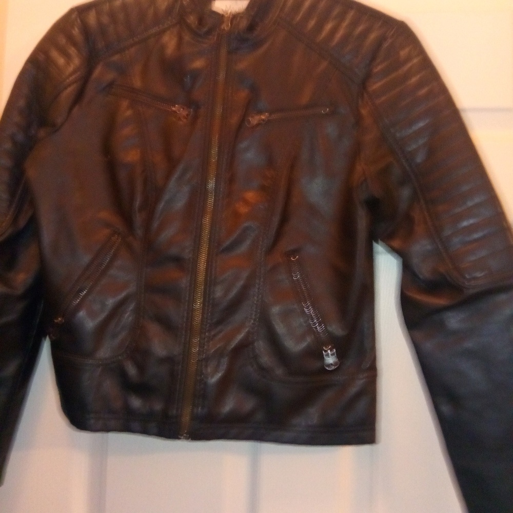 Leather jacket and fur vest